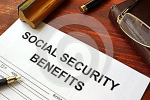 Social security benefits form and glasses. photo