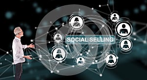 A social selling concept explained by a businessman on a wall screen