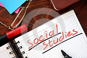 Social studies written in a notebook. photo