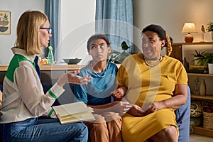 Social worker talking to adoptive family