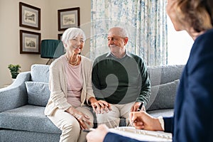 Social worker visiting seniors at home