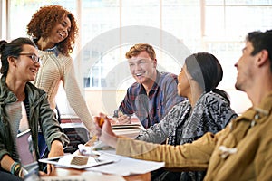 Socialising on campus. students hanging out together between class.