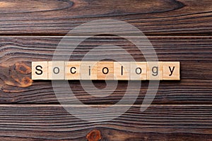 Sociology word written on wood block. Sociology text on cement table for your desing, concept