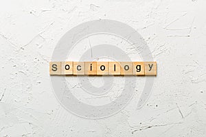 Sociology word written on wood block. Sociology text on cement table for your desing, concept photo