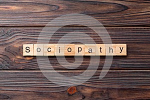 Sociopathy word written on wood block. sociopathy text on table, concept photo
