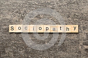 sociopathy word written on wood block. sociopathy text on table, concept photo