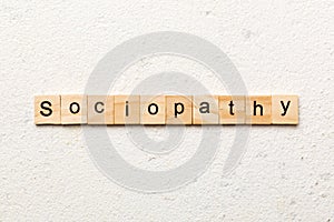 sociopathy word written on wood block. sociopathy text on table, concept photo