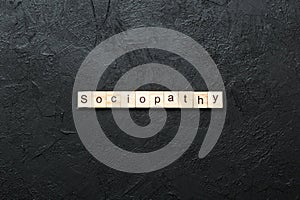 sociopathy word written on wood block. sociopathy text on table, concept photo