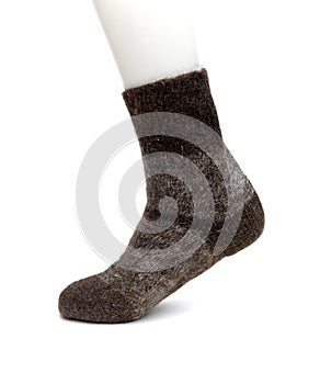 Sock made of natural sheep wool on a white background