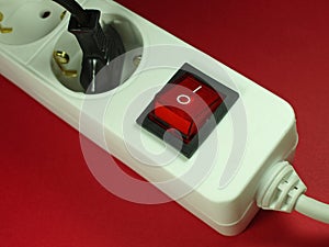 Socket in front of red background