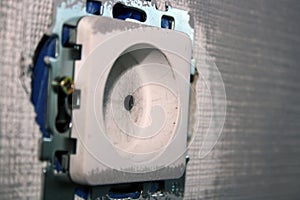 Socket on a gray-painted wall