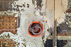 Socket orange boxes with wires in a wall. Cabling installation of electrical wires sticking out from electrical sockets hole on