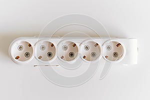 Socket pads for extension cords and surge protectors on a white background.