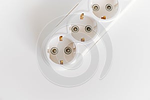 Socket pads for extension cords and surge protectors on a white background.