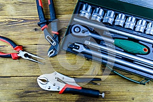 Socket set with socket wrench, adjustable water pump pliers, needle nose pliers and locking pliers. Toolkit for the car