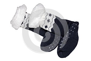 Socks isolated. Closeup of a pair of black warm thick wool socks with ornaments for cold winter isolated on a white backgrou