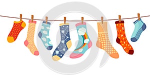 Socks on rope. Cotton or wool sock dry and hang on laundry string with clothespins. Children socks with textures and