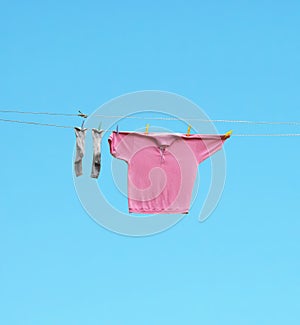 Socks and shirt hang out to dry