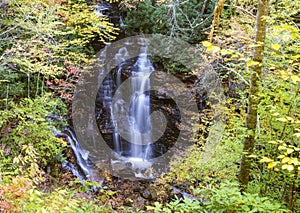 Soco Falls surrounded by fall leaves.