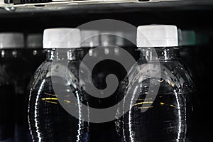 Soda Bottles in Vending Machine White Bottle Caps Black Liquid R