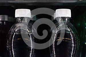 Soda Bottles in Vending Machine White Bottle Caps Black Liquid R