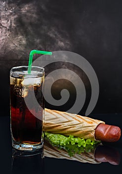 Soda with ice and pigs in a blanket hot dog