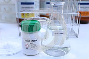 Sodium chloride in chemical container , chemical in the laboratory and industry photo