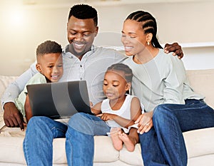 Sofa, black family and happy with laptop for movie streaming at home to relax and bond. Smile, couch and mother, father