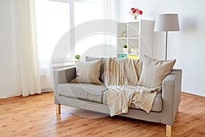 Sofa with cushions at cozy home living room
