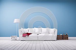 Sofa and floor lamp at blue wall photo