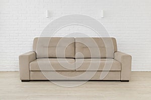 Sofa in living room interior on white brick wall background