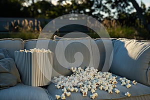 sofa in outdoor setting with popcorn for openair movie
