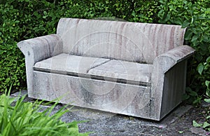 A sofa or park bench in concrete