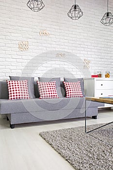 Sofa with red pillows