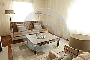 Sofas lamps and coffee table in home lounge room