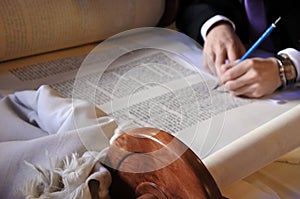 Sofer completing the final letters of sefer Torah