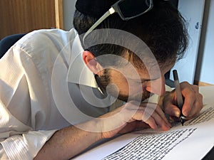 Sofer writes a sefer Torah