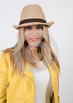 Sofia in photographic studio with a beige hat