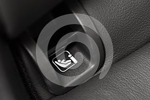 SOFIX sign on black leather background. ISOFIX for child car seats - Image photo