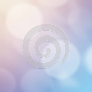 A soft, abstract background featuring diffused, overlapping bokeh circles in pastel