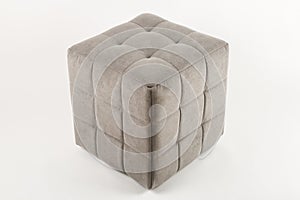 Soft beige pouf on a white background