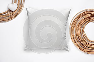 Soft blank pillow, dried osier or willow rolled into a circle and a heart made of fabric isolated on white. Close up