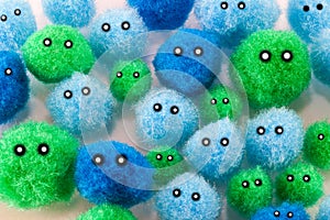 Soft blue and green pompoms faces