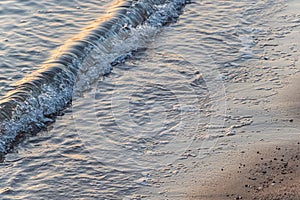 Soft blue ocean wave on clean sandy beach in Egypt