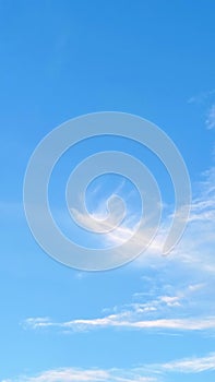 Soft Blue Sky with Wispy White Clouds