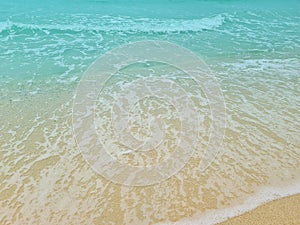 Soft blue waves on a clean sandy beach. travel photos