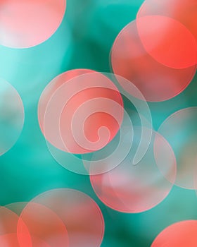 Soft blurred peachy coral, minty teal, and shimmering bronze colors bokeh background