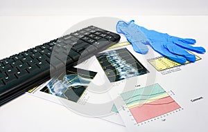 Bone Densitometer hip and spine report paper under keybord .on the teble doctor room white background photo