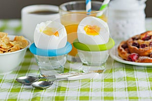 Soft boiled chicken egg, coffee, muesli and orange juice