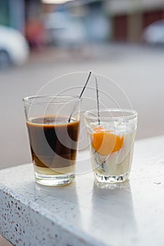 soft boiled egg in glass, hot coffee in glass ,Thai coffee, Viet